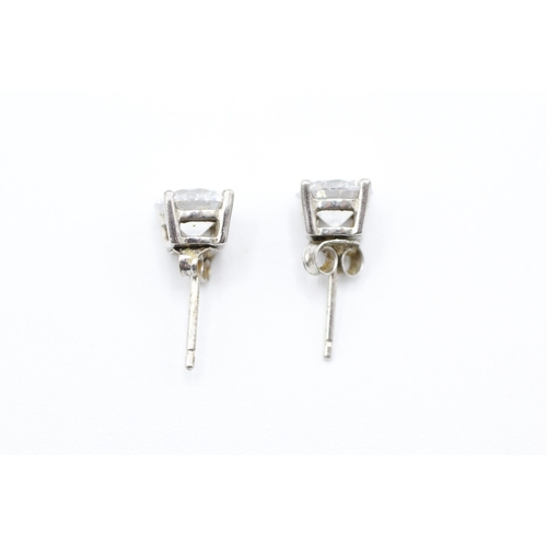 242 - 9ct white gold cubic zirconia solitaire stud earrings (1.6g)