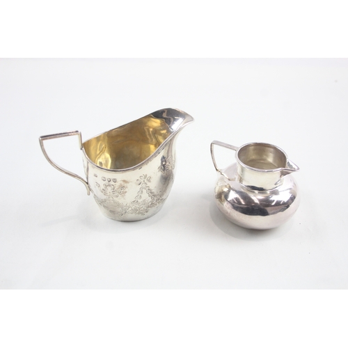 60 - 2 x .925 sterling silver cream jugs