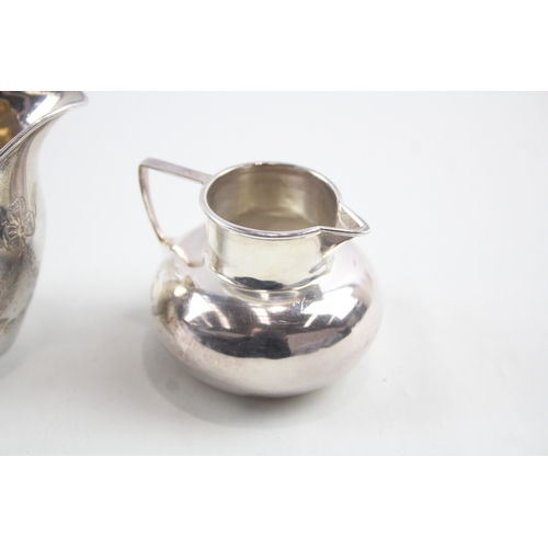 60 - 2 x .925 sterling silver cream jugs