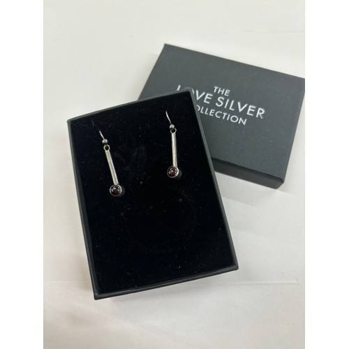 534 - Silver Stone set garnet earrings by Adrian Gerald Benney