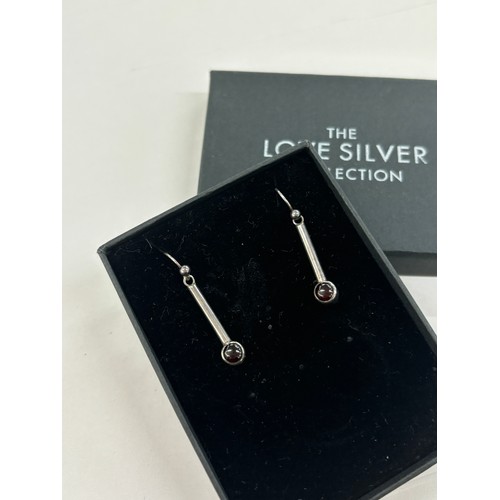 534 - Silver Stone set garnet earrings by Adrian Gerald Benney