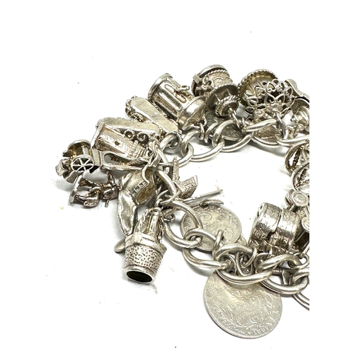 273 - Heavy vintage silver charm bracelet incluses opening charms etc weight 118g