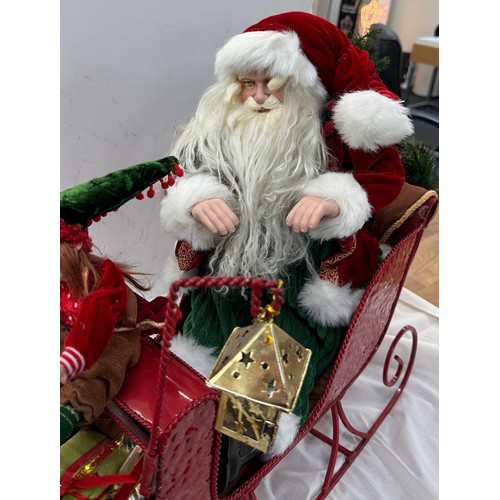 324 - Santa and Elf, metal sleigh Christmas decoration, approximate measurements: Length 35 inches, Height... 