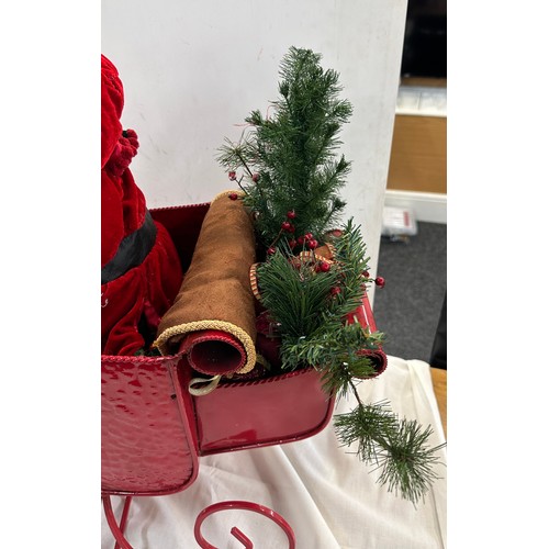 324 - Santa and Elf, metal sleigh Christmas decoration, approximate measurements: Length 35 inches, Height... 