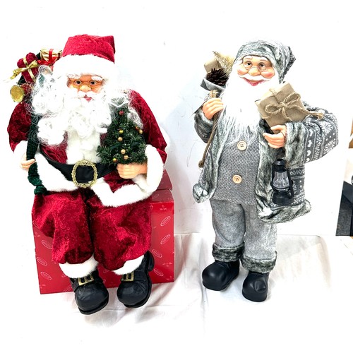 322 - Freestanding Santa decoration, a sitting Santa decoration, tallest measures approximately24 inches