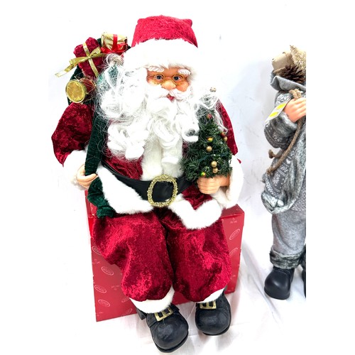 322 - Freestanding Santa decoration, a sitting Santa decoration, tallest measures approximately24 inches