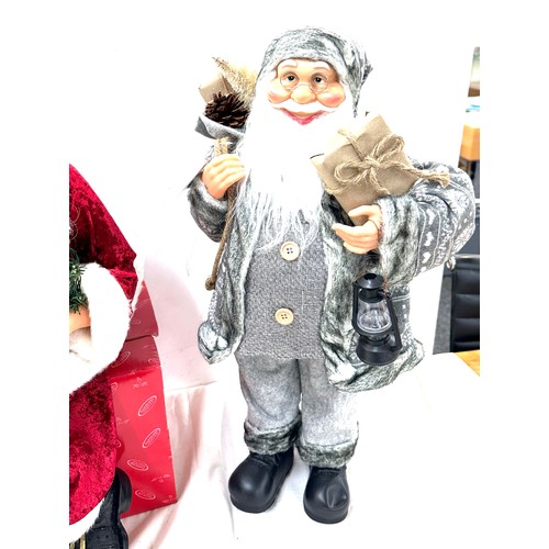 322 - Freestanding Santa decoration, a sitting Santa decoration, tallest measures approximately24 inches