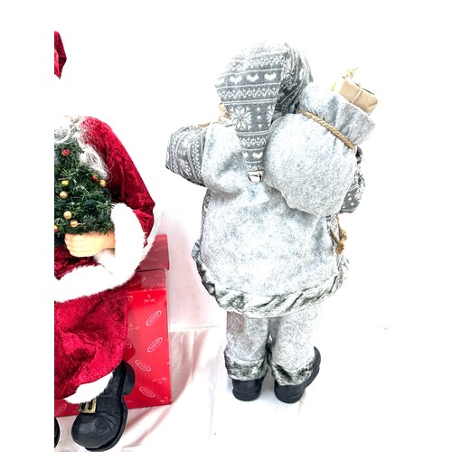 322 - Freestanding Santa decoration, a sitting Santa decoration, tallest measures approximately24 inches