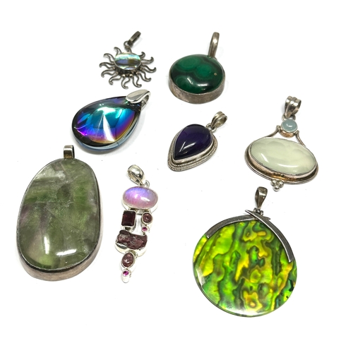 291 - 8 silver stone set pendants weight 125g