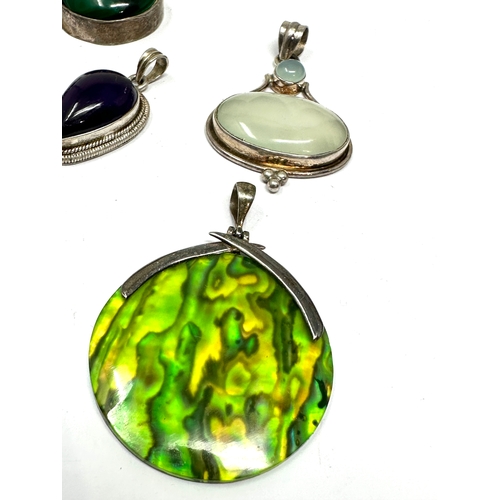 291 - 8 silver stone set pendants weight 125g