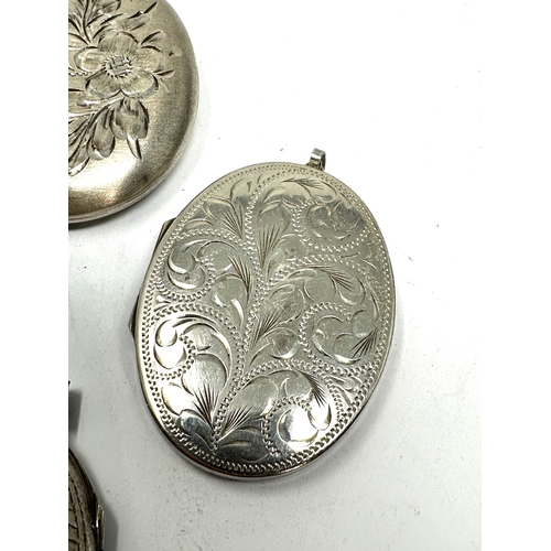 296 - 4 large vintage silver lockets weight 54g largest measures approx 5cm by 4cm