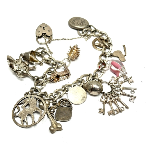 306 - vintages silver charm bracelet weight 44g