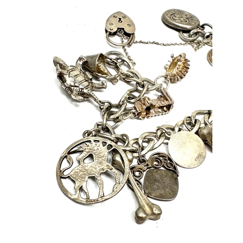 306 - vintages silver charm bracelet weight 44g