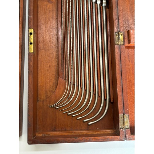 601 - Antique 19th century mahogany cased medical instruments, two layers of catheters, box measures appro... 