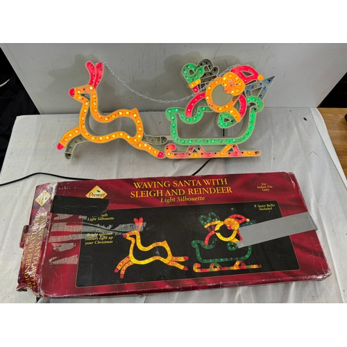 366 - Boxed light silhouette of a waving Santa with sleigh and reindeer, approximate length 24 inches, Hei... 