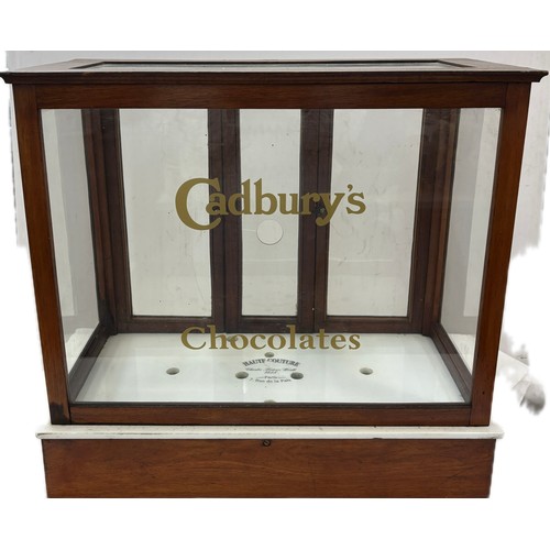 43 - Wooden and glass counter top Cadburys collectables display case, approximate measurements: Height 19... 