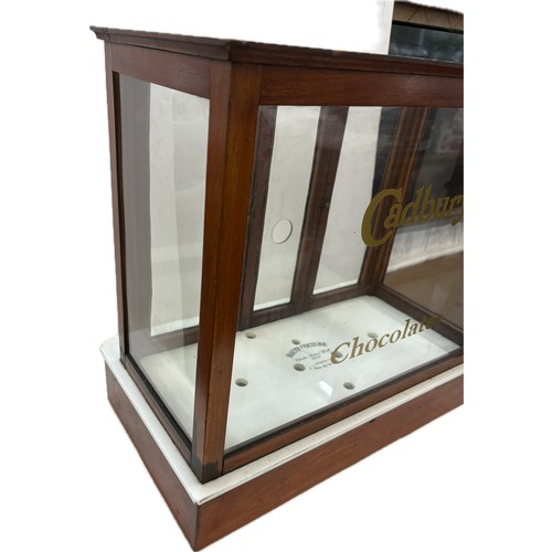 43 - Wooden and glass counter top Cadburys collectables display case, approximate measurements: Height 19... 