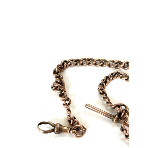 560 - Rose gold 9ct Albert chain with 9ct spinning fob pendant, total overall weight 33g