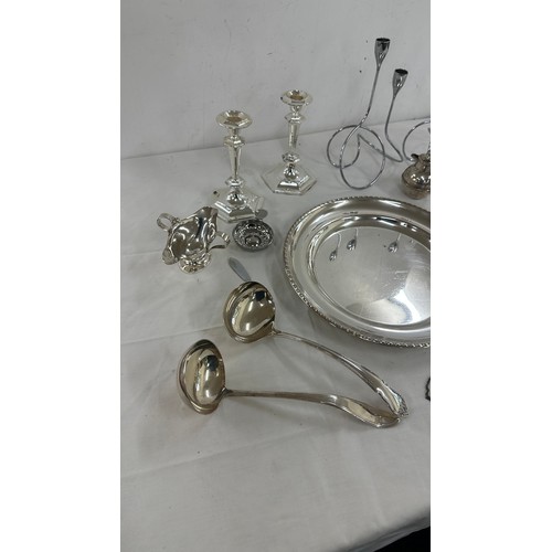 104 - Selection of silver plate items to include candle sticks, pen, trays etc