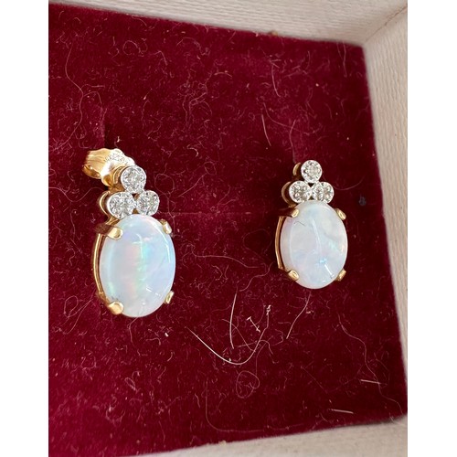 575 - Pair of 14ct gold and opal earrings