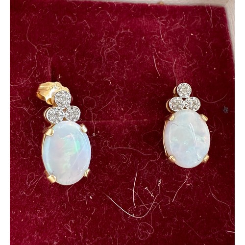 575 - Pair of 14ct gold and opal earrings