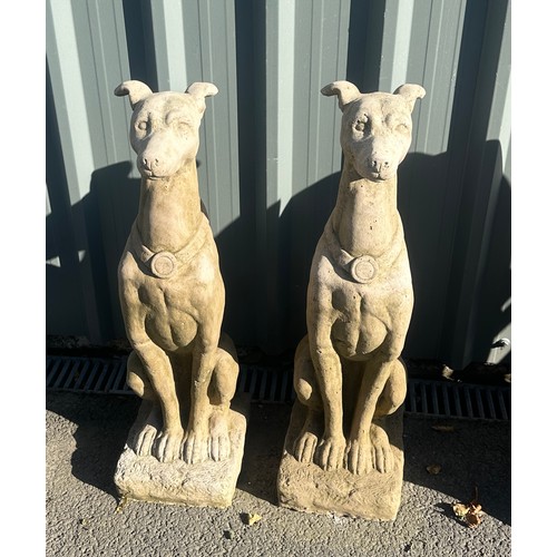 100B - Pair of concrete dogs measures approximately 31 inches tall