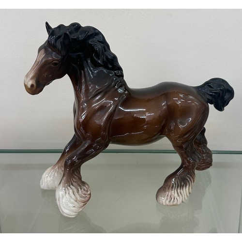 619 - Porcelain Beswick horse figure measures approximately 9 inches wide by 9 inches tall