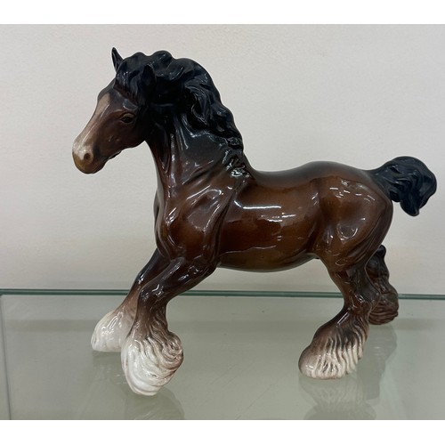 619 - Porcelain Beswick horse figure measures approximately 9 inches wide by 9 inches tall