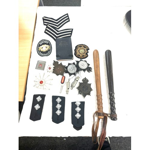 576 - Selection of police ephemera includes cloth badges and truncheons