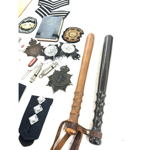 576 - Selection of police ephemera includes cloth badges and truncheons