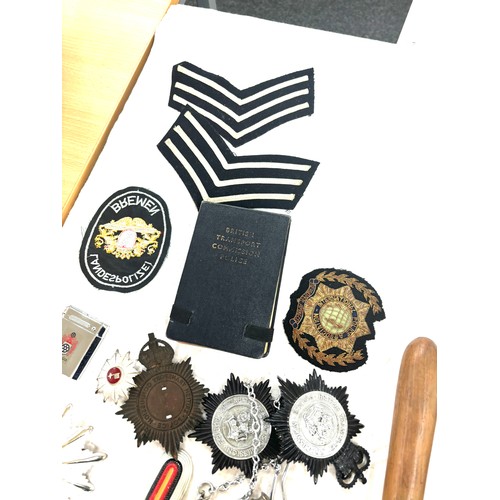 576 - Selection of police ephemera includes cloth badges and truncheons