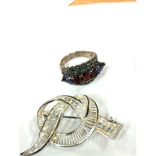 586 - Selection of silver jewellery includes amber bracelet, brooches, ring etc