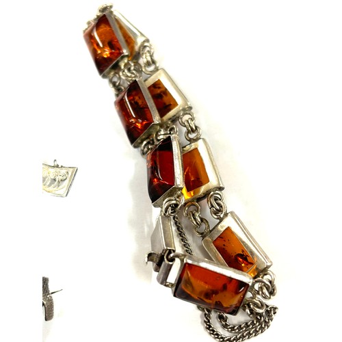 586 - Selection of silver jewellery includes amber bracelet, brooches, ring etc