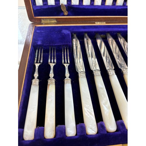 86 - Cased set of silver plated dessert knives and forks by A & D Sheffield, mother of pearl handles