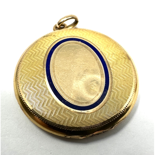 110 - Vintage gold shell & enamel locket measures approx 4cm drop by 3cm wide weight 12.5g