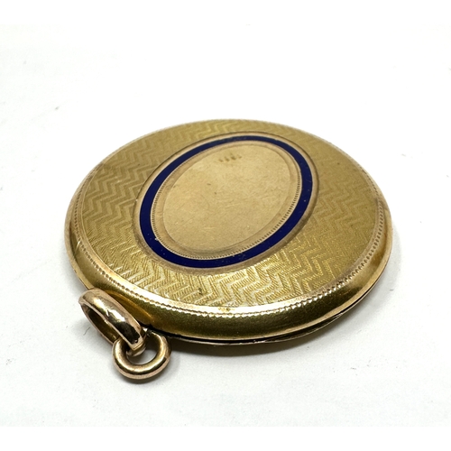 110 - Vintage gold shell & enamel locket measures approx 4cm drop by 3cm wide weight 12.5g