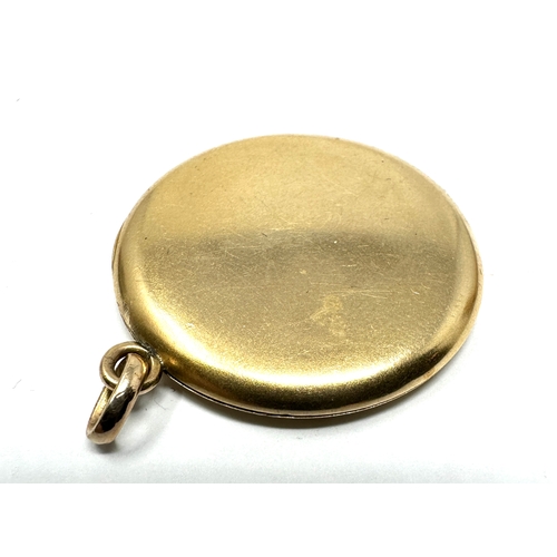 110 - Vintage gold shell & enamel locket measures approx 4cm drop by 3cm wide weight 12.5g