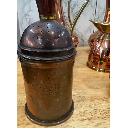 99 - Selection of copper and brass jugs, tallest measures approximately 15 inches