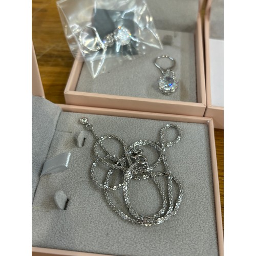 596 - 5 Boxed silver and stone set Diamonique necklaces and bracelets