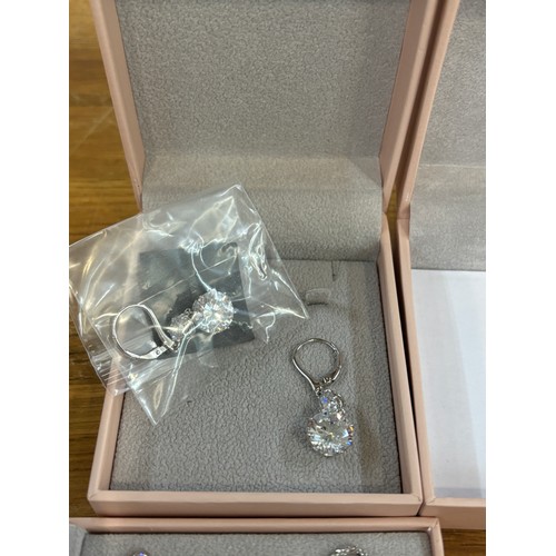 596 - 5 Boxed silver and stone set Diamonique necklaces and bracelets