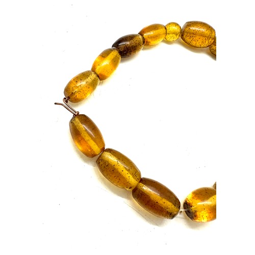 560 - Vintage amber and horn bead necklace, plus one other