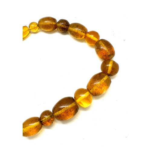 560 - Vintage amber and horn bead necklace, plus one other