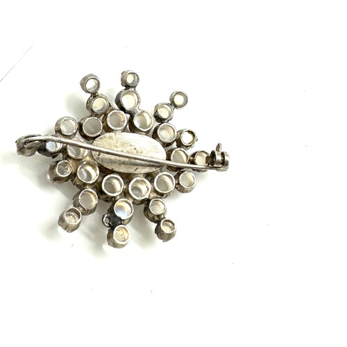 581 - Large antique moonstone brooch (1 stone missing), set in white metal, approximate size 4.6 x 3.8cm