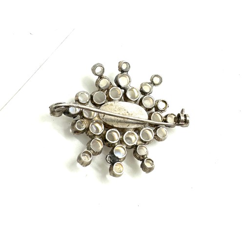 581 - Large antique moonstone brooch (1 stone missing), set in white metal, approximate size 4.6 x 3.8cm