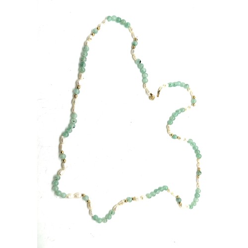 556 - Jade, Pearl and 14ct gold necklace, length 80cm, weight 35g