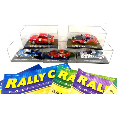 31 - 5 cased rally cars, with magazines to include a Porsche 911 Carrera RS, Datsun 240Z, Saab 96V4, Ford... 