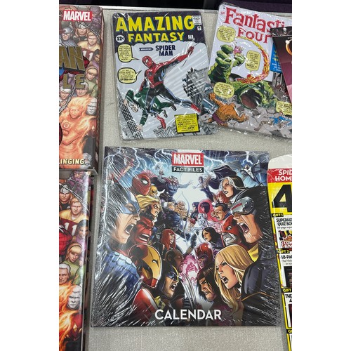 11 - Selection of Marvel merchandise to include fact files calendar, Spiderman and Fantastic Four tin wal... 