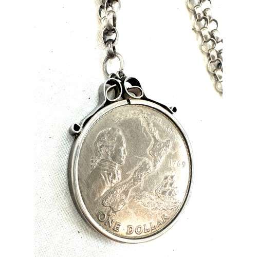 352 - Silver chain with a mounted one dollar coin and a silver coin with copper chain