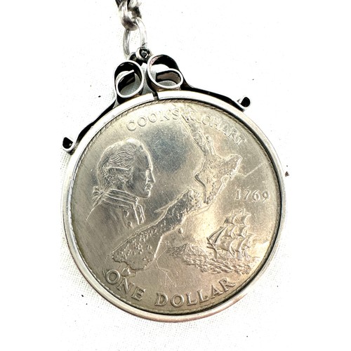 352 - Silver chain with a mounted one dollar coin and a silver coin with copper chain