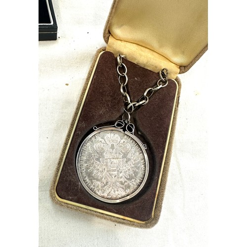 352 - Silver chain with a mounted one dollar coin and a silver coin with copper chain